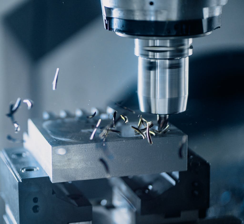 Close-up of a CNC milling machine working on metal for precise manufacturing.